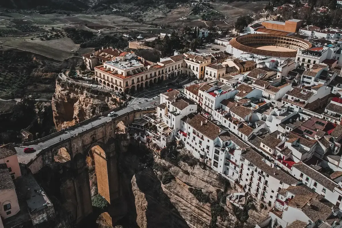 Aerial view of Ronda with its bullring, the Puente Nuevo and the old town above the Tajo gorge